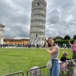 Carla pictured in front of the Leaning Tower of Pisa